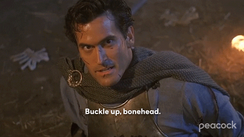 Bruce Campbell in medieval armor intensely saying 'buckle up, bonehead